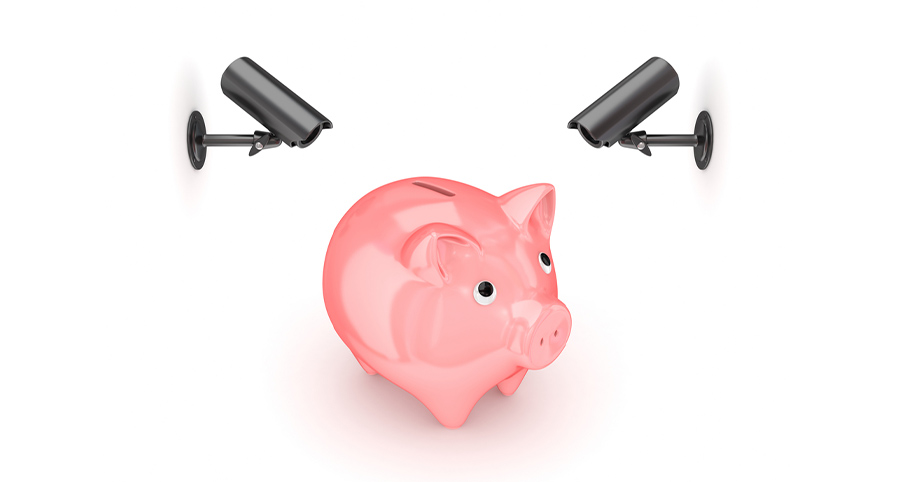 piggy bank with two security cameras